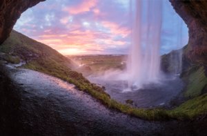 Capturing the beauty from Seljalandsfoss, this photo shows the view from behind the cascade of water, as this is one of the only waterfalls you can walk behind