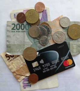 Image of cards, foreign coins and notes