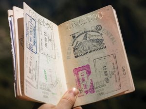 Open passport showing country stamps